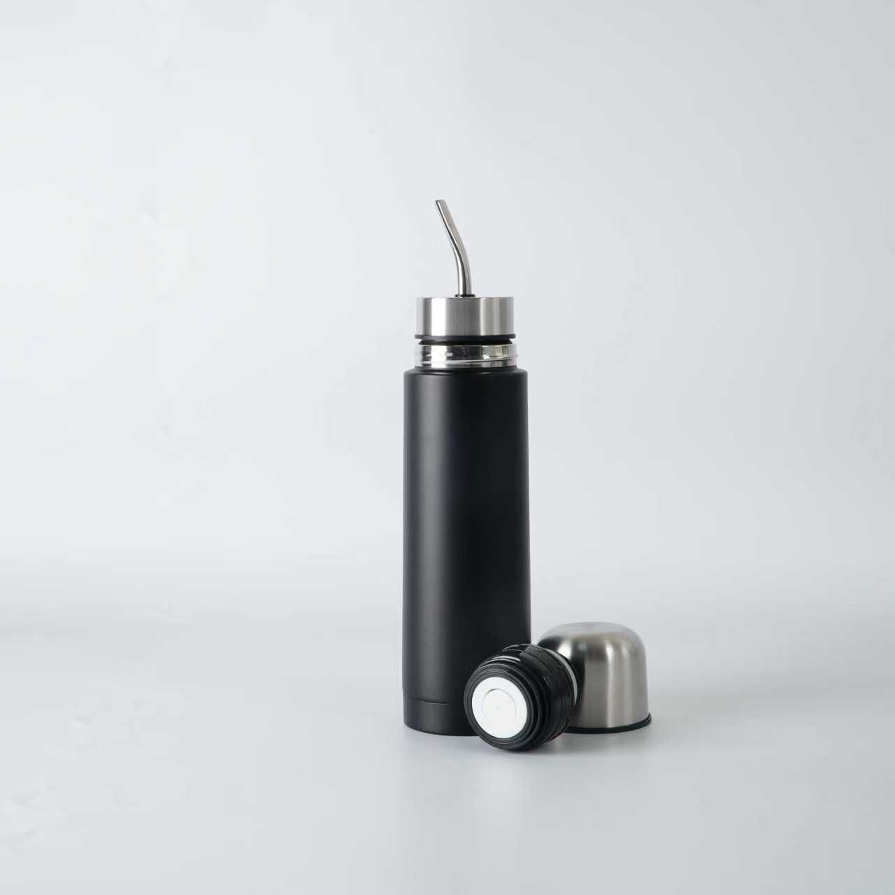 Black insulated mate tea bottle with stainless steel straw and detachable lid