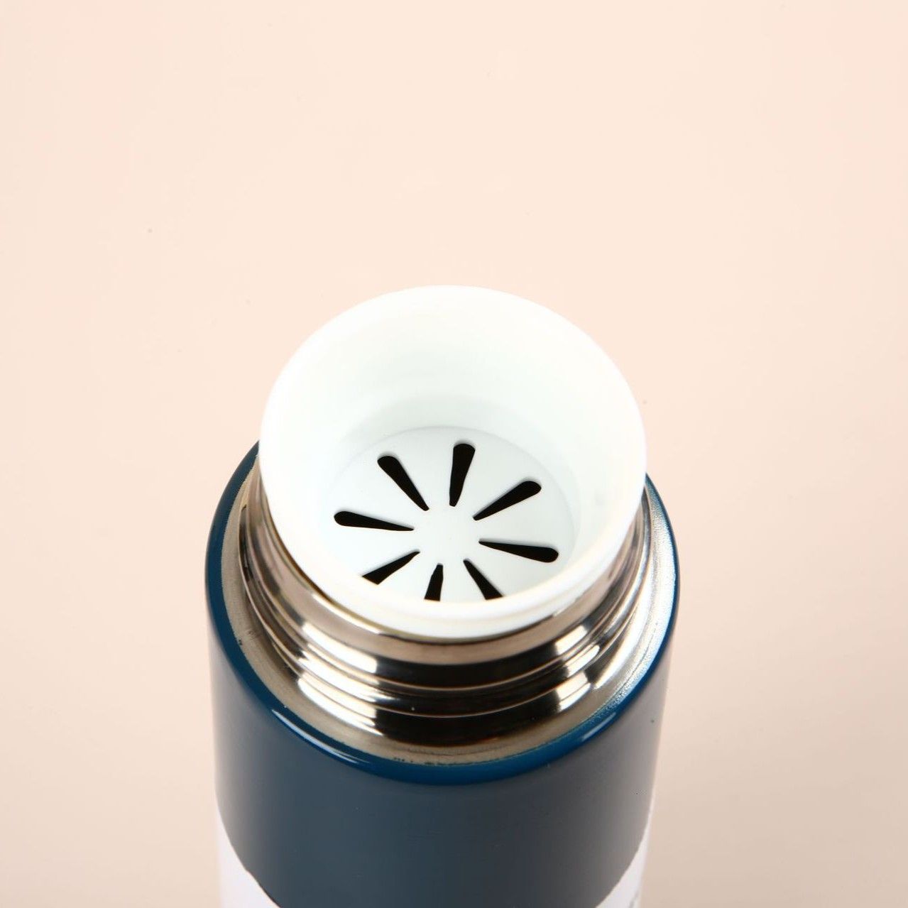 Stainless steel vacuum bottle mouth detail with internal tea infuser, OEM custom drinkware