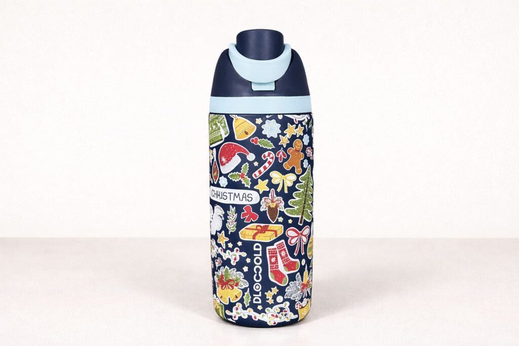 Christmas-themed 3D UV printed stainless steel water bottle with raised full-wrap holiday artwork on a light background