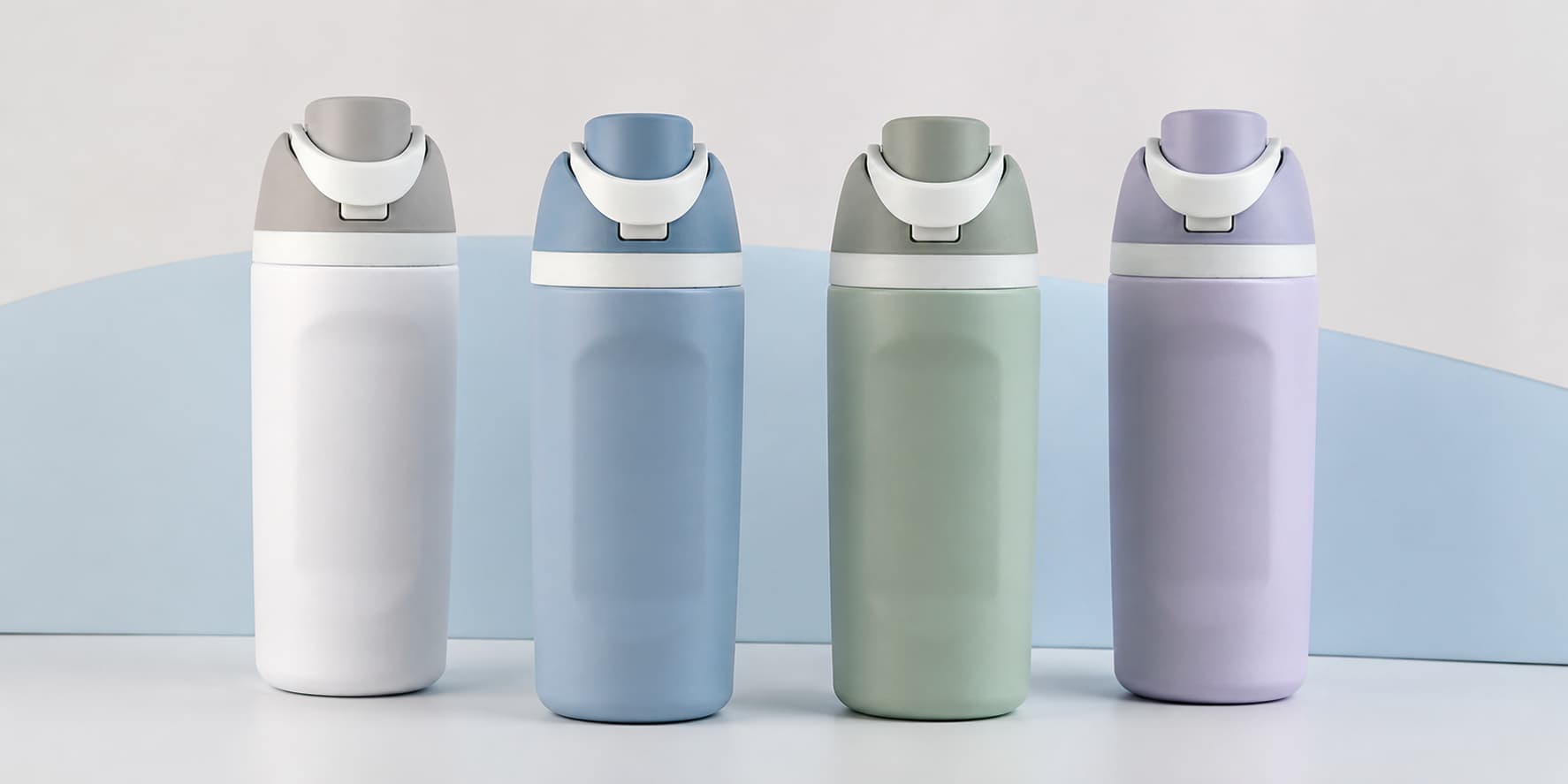 Flip-sip stainless steel sports bottles in white, blue, green and lavender