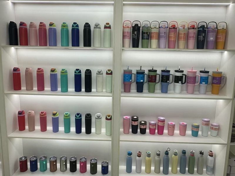 Showroom wall display of custom stainless steel bottles and tumblers