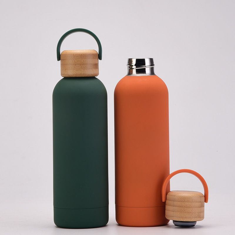 Wholesale insulated stainless steel bottles with wooden screw lid and carrying handle