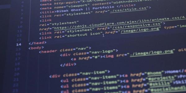 Close-up view of HTML and CSS code displayed on a computer screen, ideal for programming and technology themes.