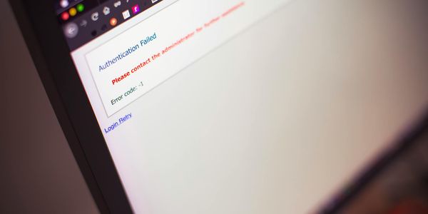 Close-up of a computer screen displaying an authentication failed message.