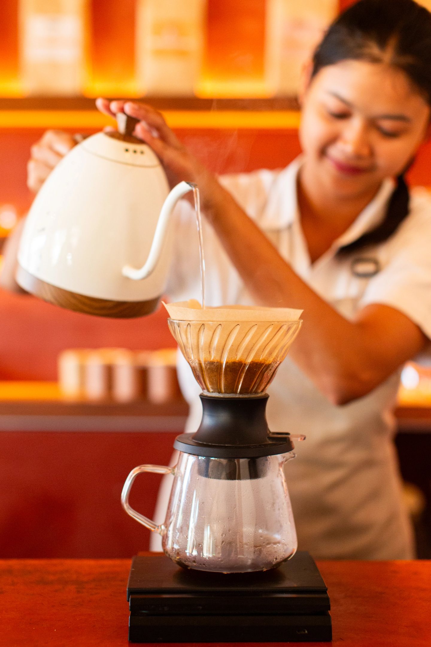 Barista pouring V60 hand brew coffee at House of Sunday, Batu Bolong