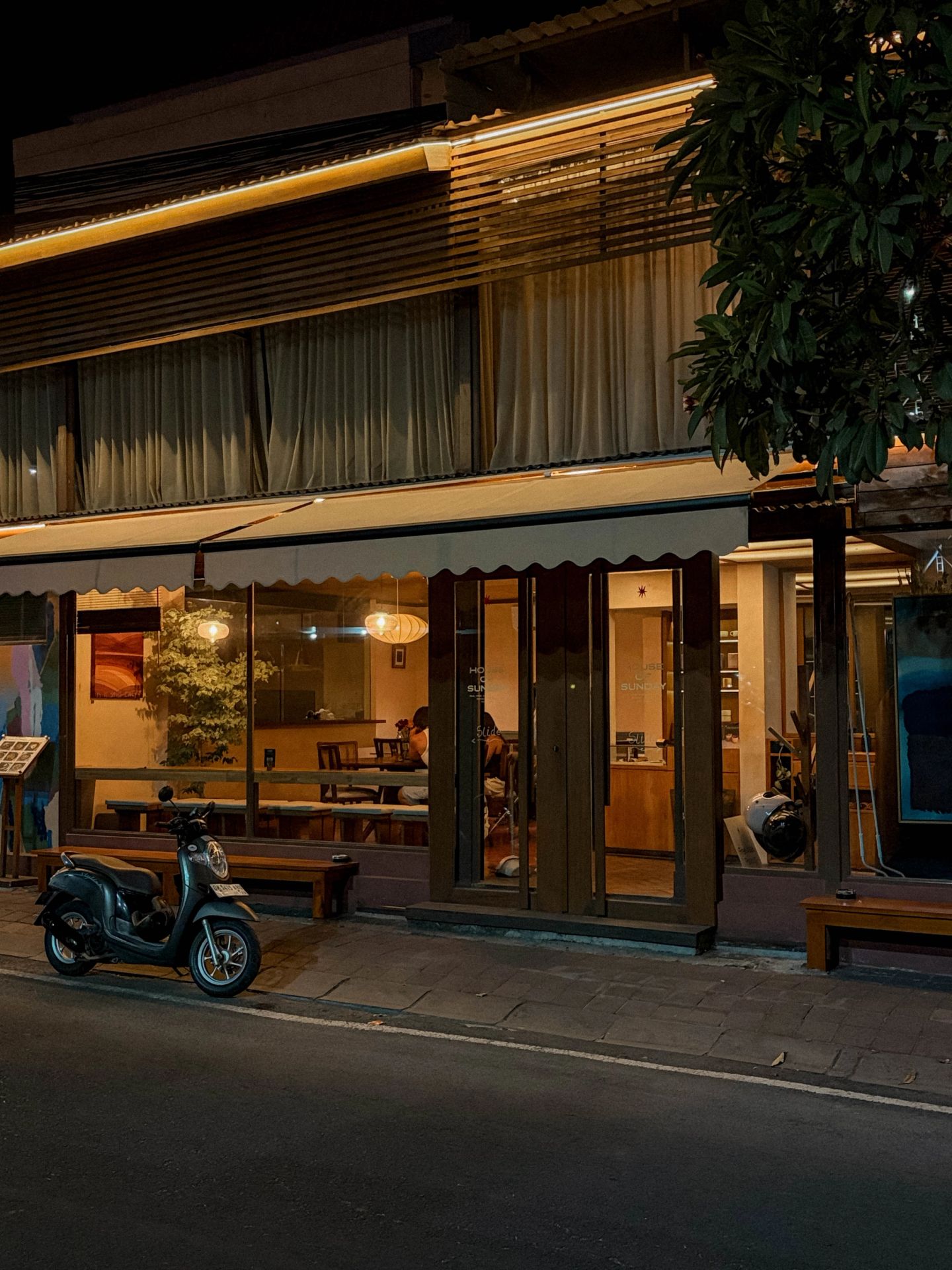 Guests reading the menu outside House of Sunday, Batu Bolong, Canggu