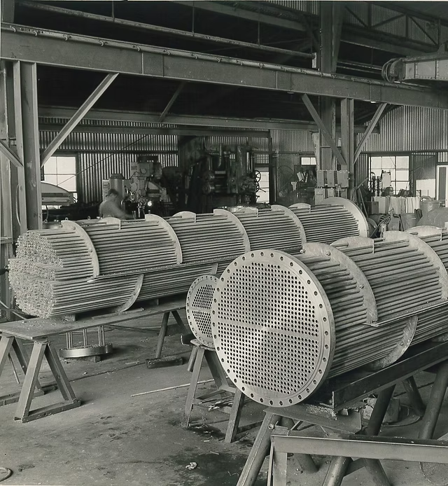 industrial heat exchanger tube bundle, specifically identified as tube bundles for a heat exchanger in a factory setting. 