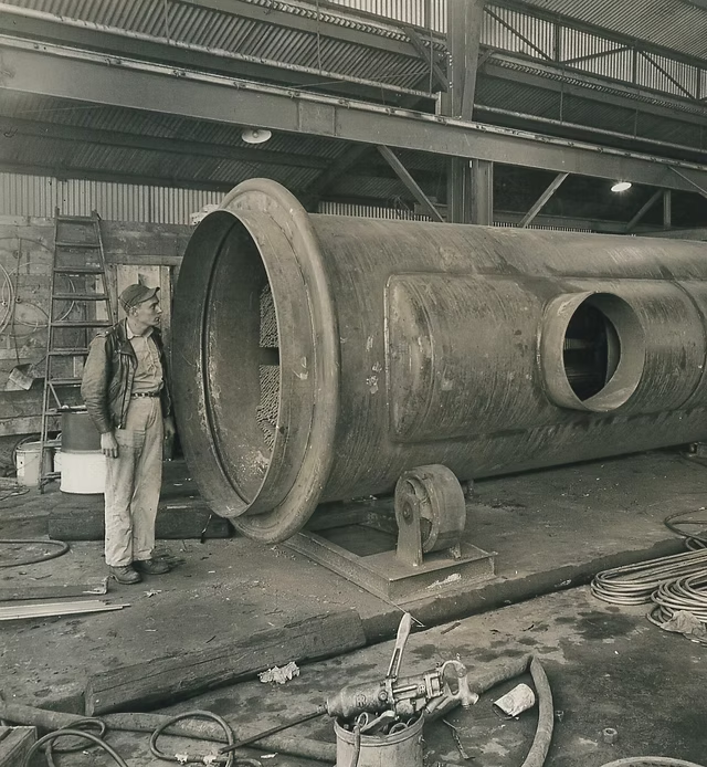 component, specifically a rocket fuel tank being welded at the Rocketdyne facility in Canoga Park, California. 