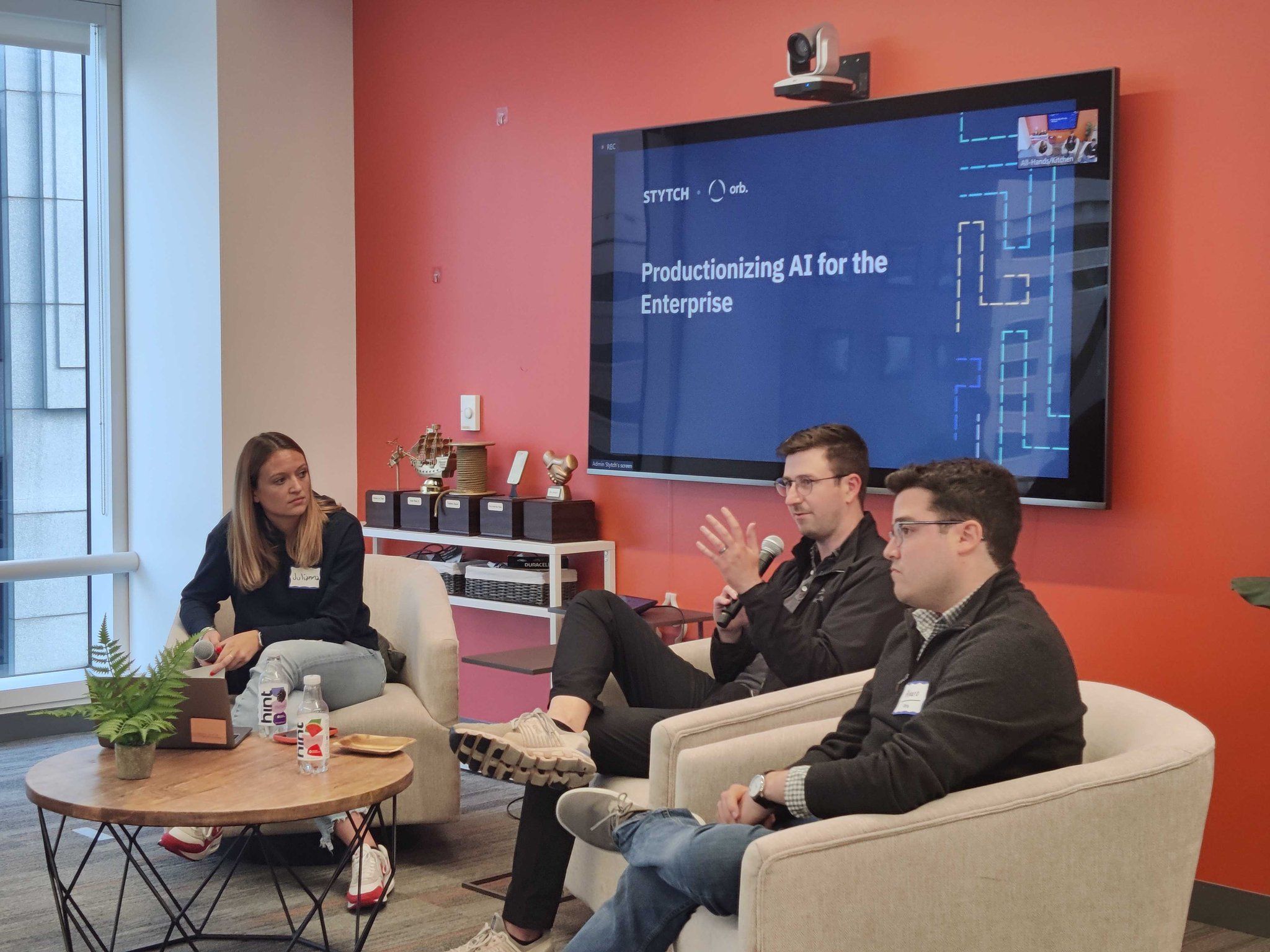 A photo of Stytch co-founders Julianna Lamb and Reed McGinley-Stempel talking with Orb co-founder and CEO Alvaro Morales