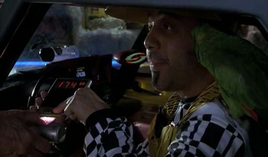 A screenshot from Back to the Future II, of Biff driving a Taxi