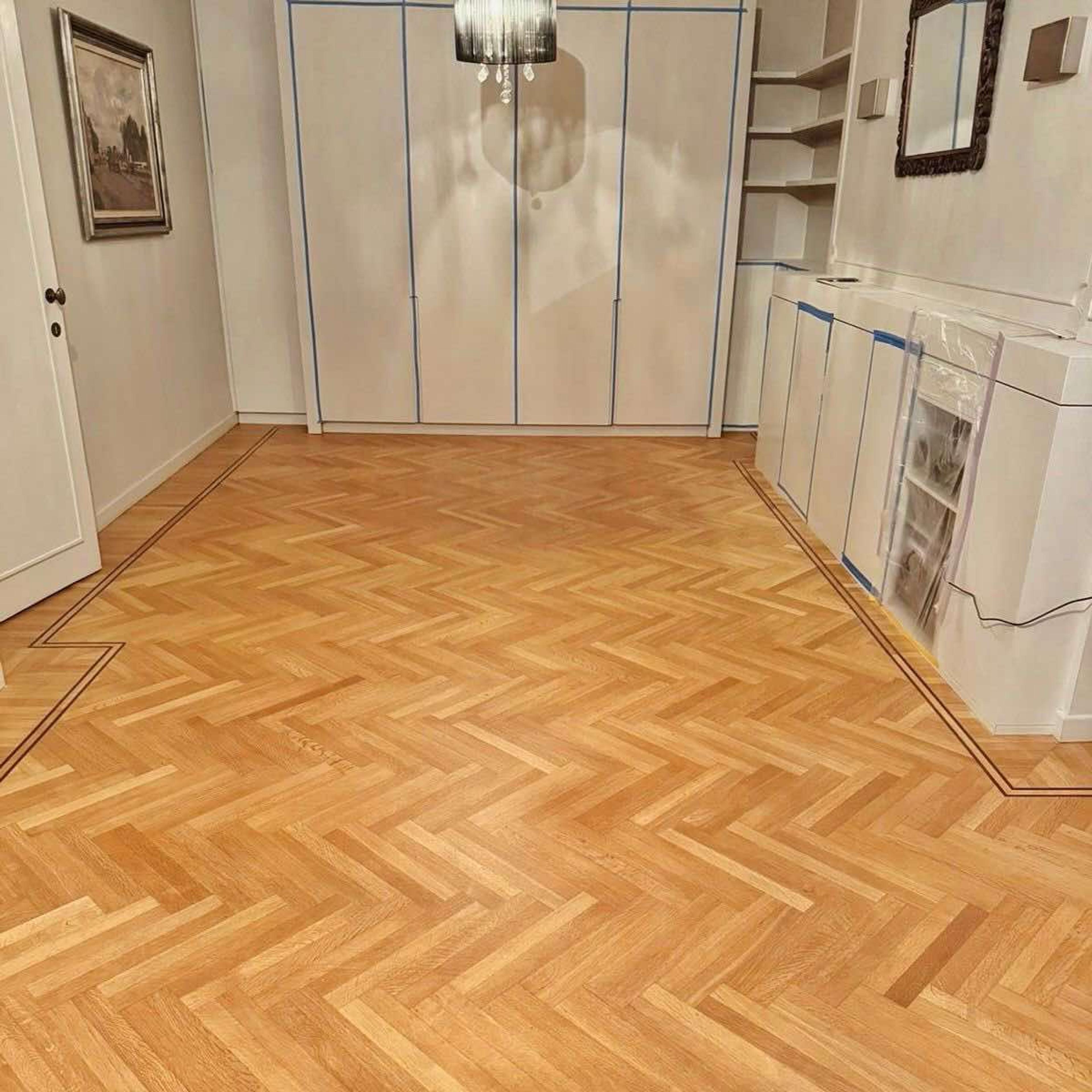 schuren van visgraatparket in Tielt