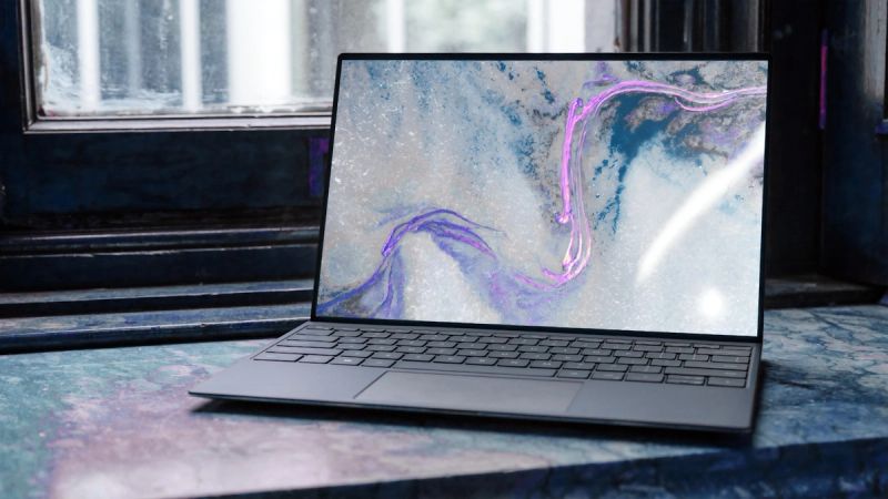Laptop on a desk with code on screen