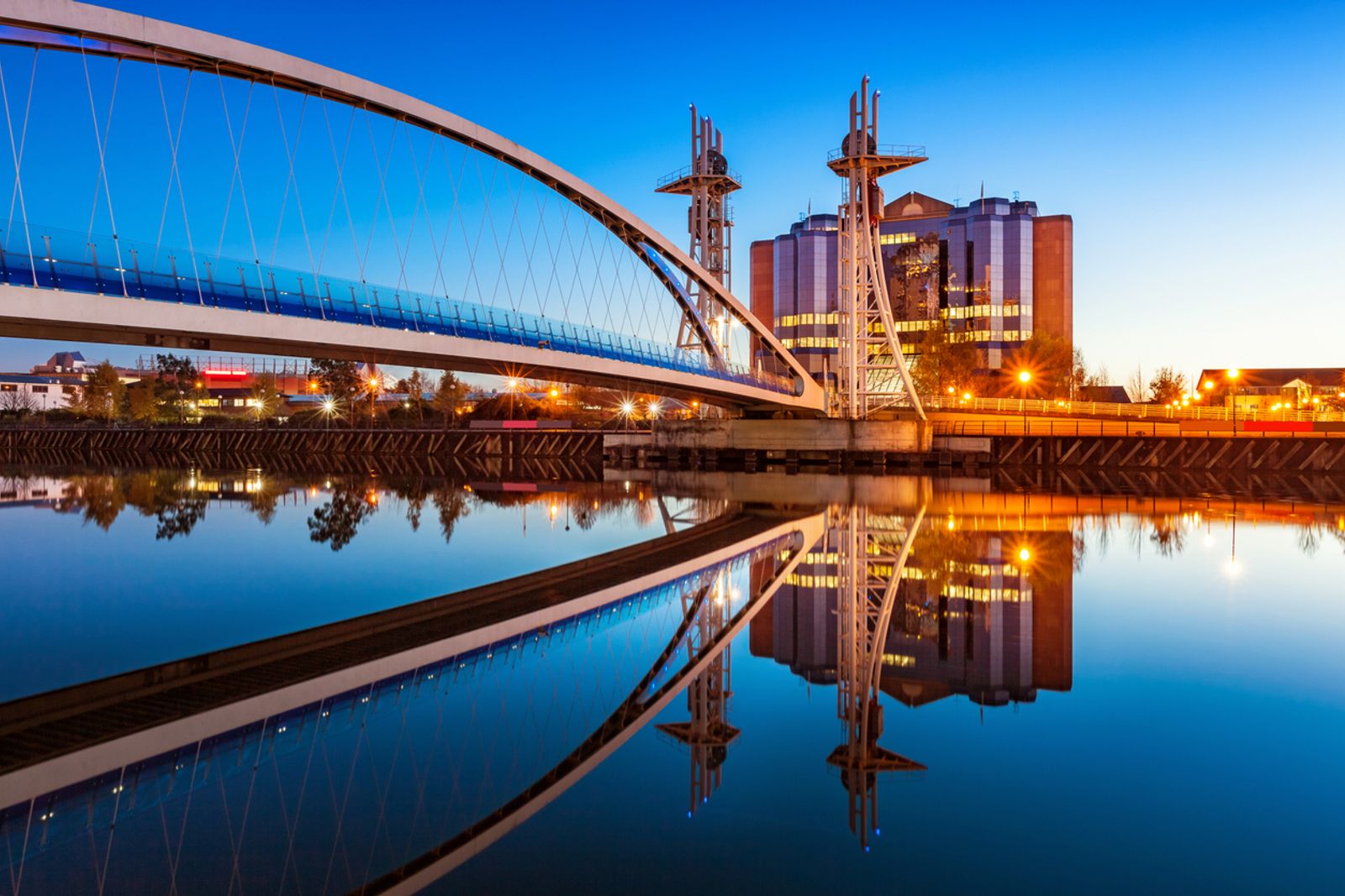 Millenium Bridge at Salford Quays in Manchester, England at twilight blue hour