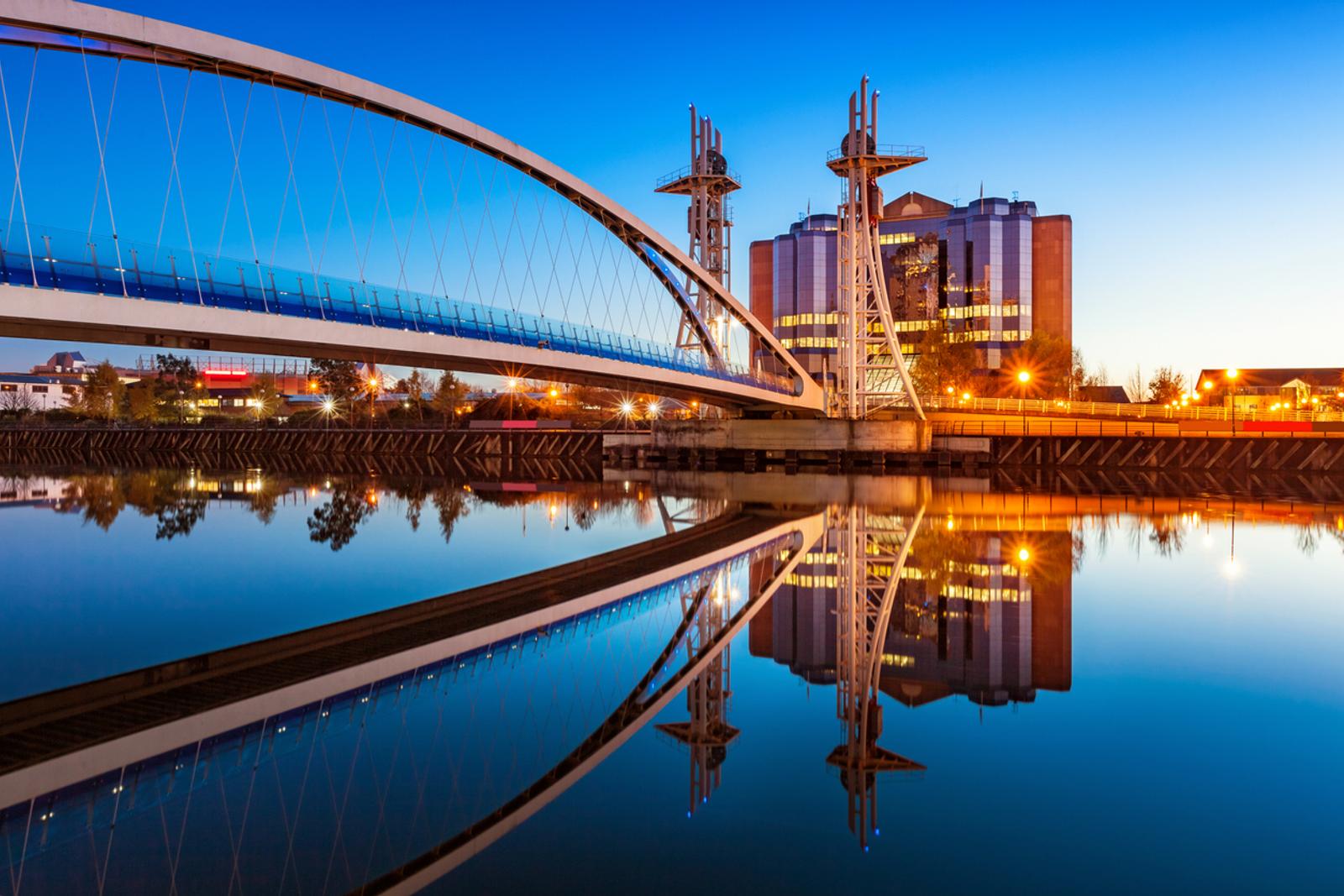 Millenium Bridge at Salford Quays in Manchester, England at twilight blue hour