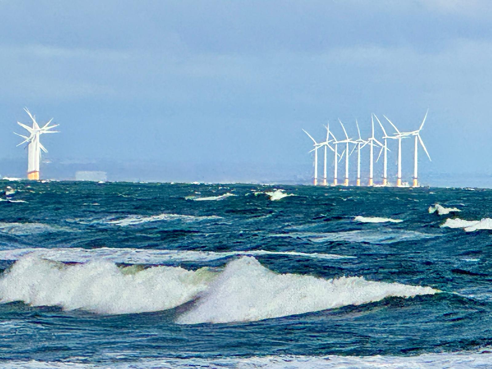 Rows of wind turbines in the North Sea at Saltburn-by-the-Sea