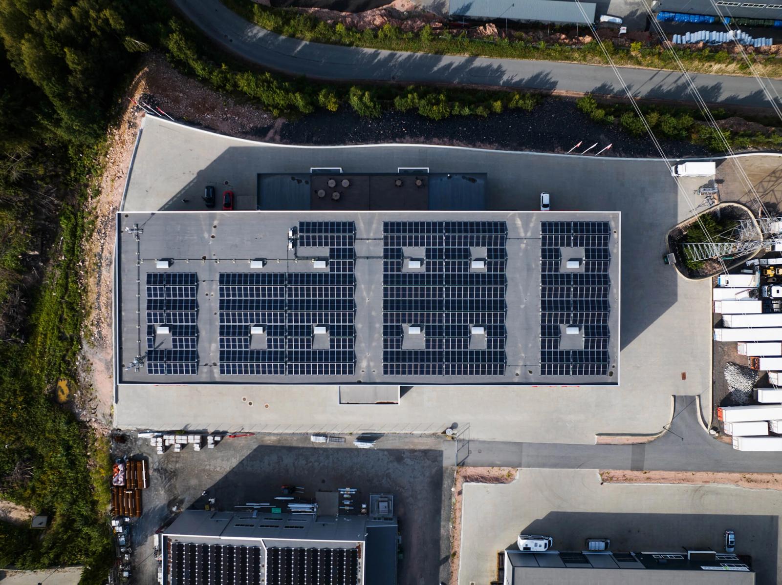 Aerial view of a rooftop with solar panels