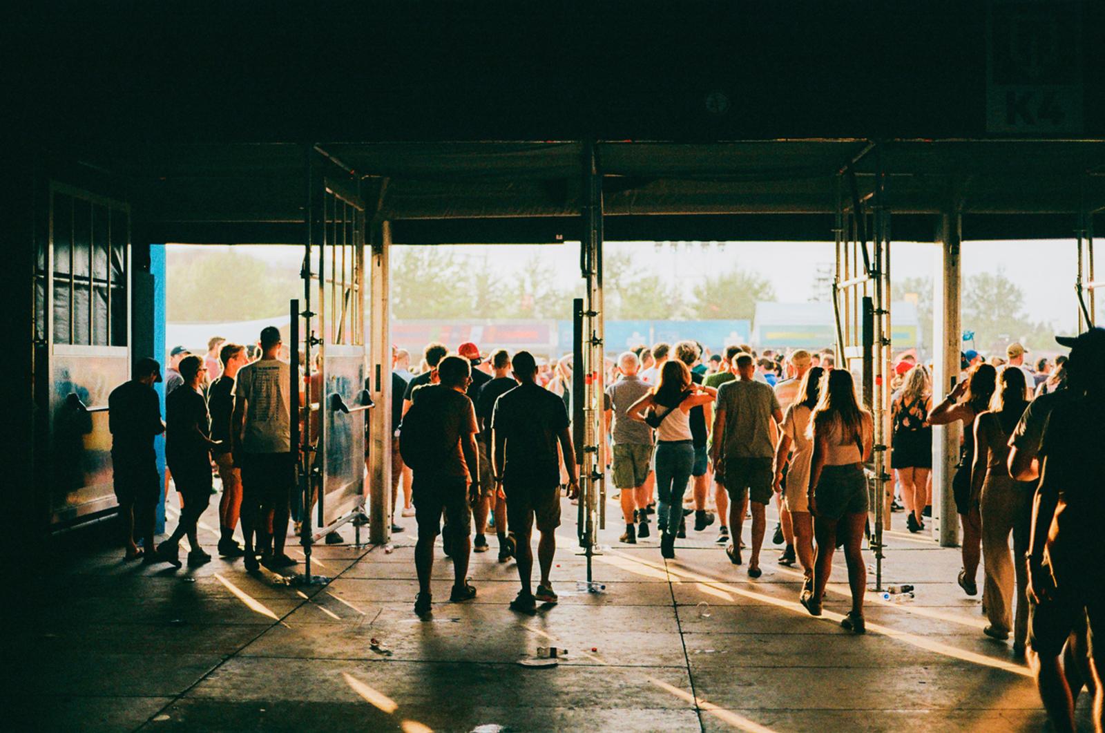 Crowd of people entering music festival