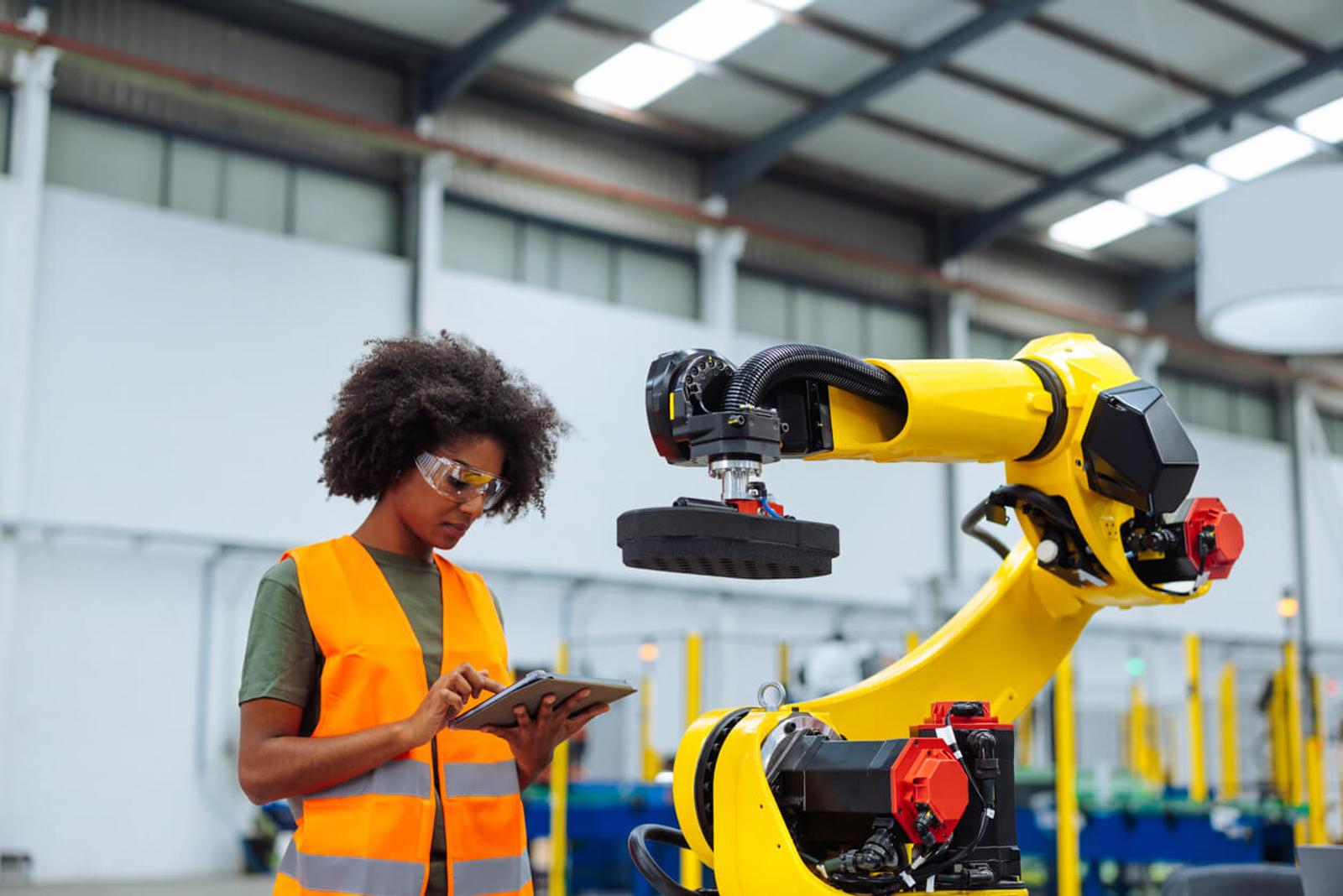 A female warehouse worker works alongside an ISR