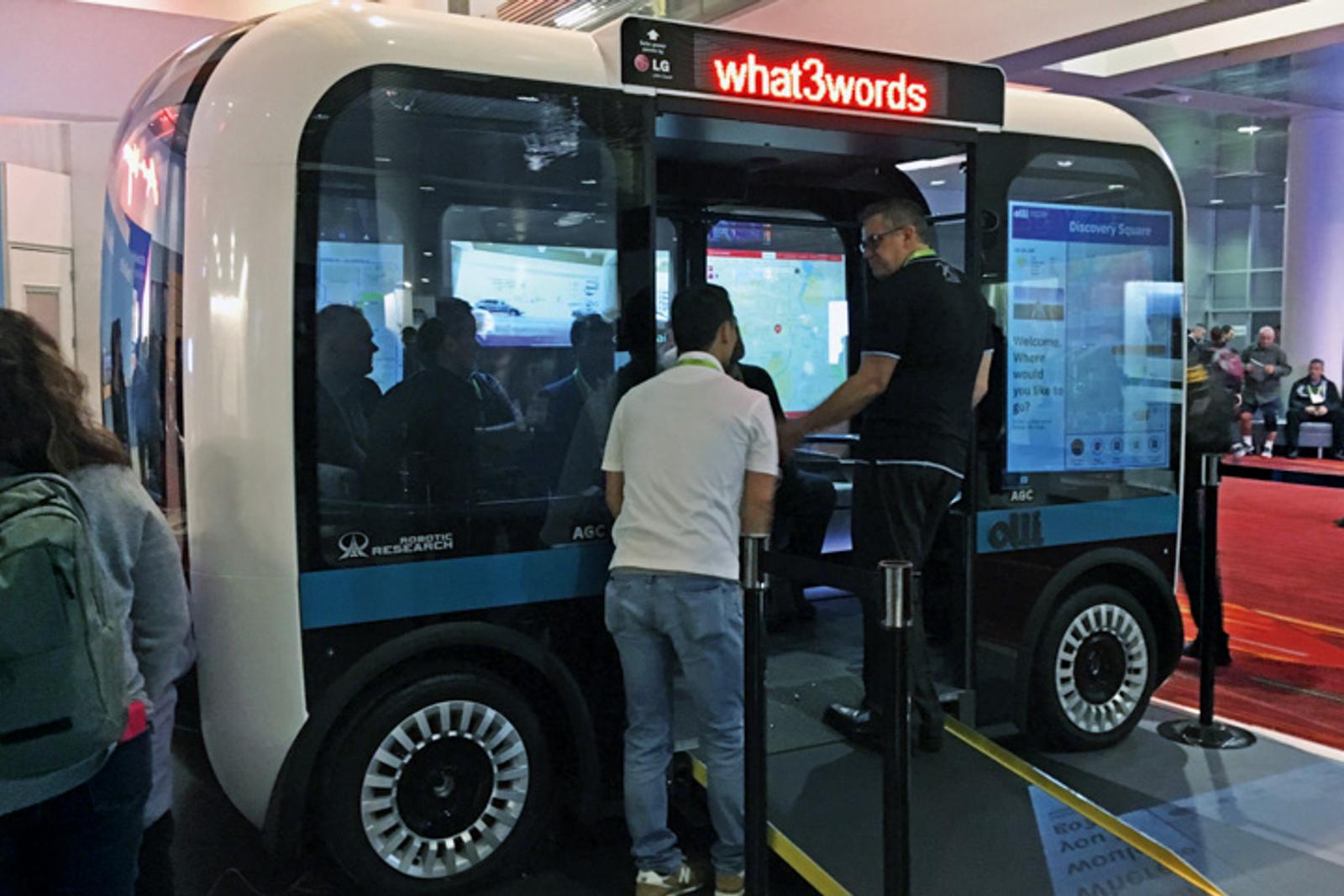 People explore a Nuro vehicle