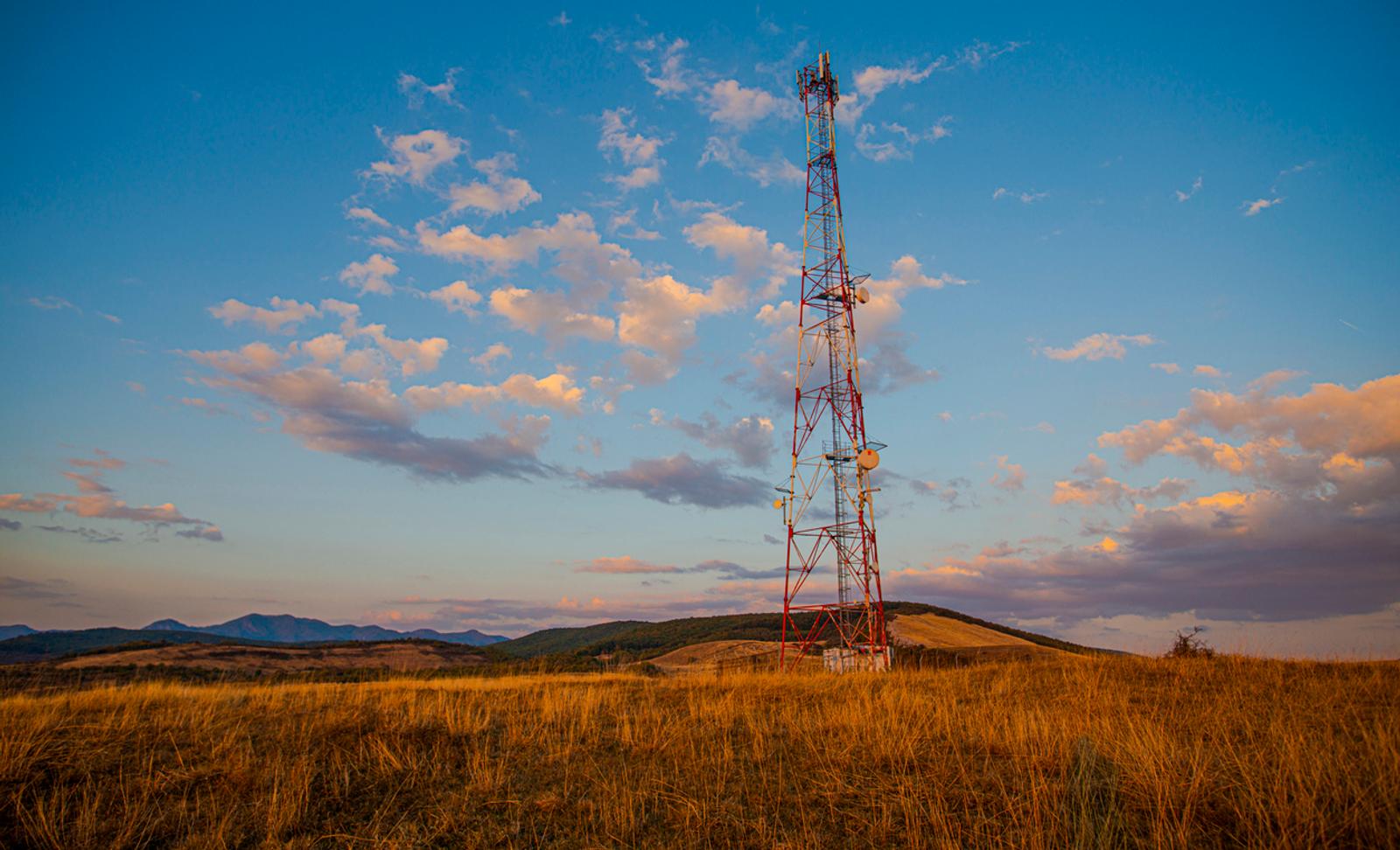 A cellular tower in a field