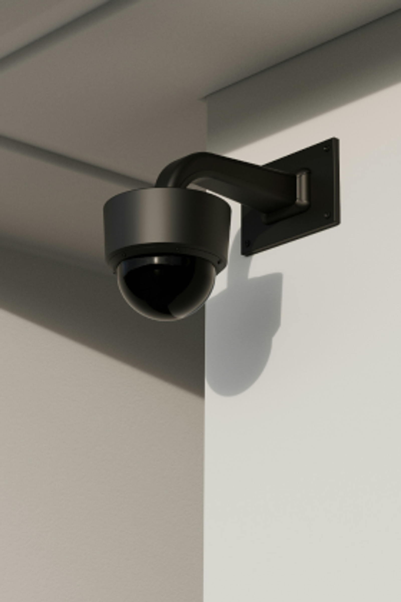 A security camera mounting to the wall of an office building