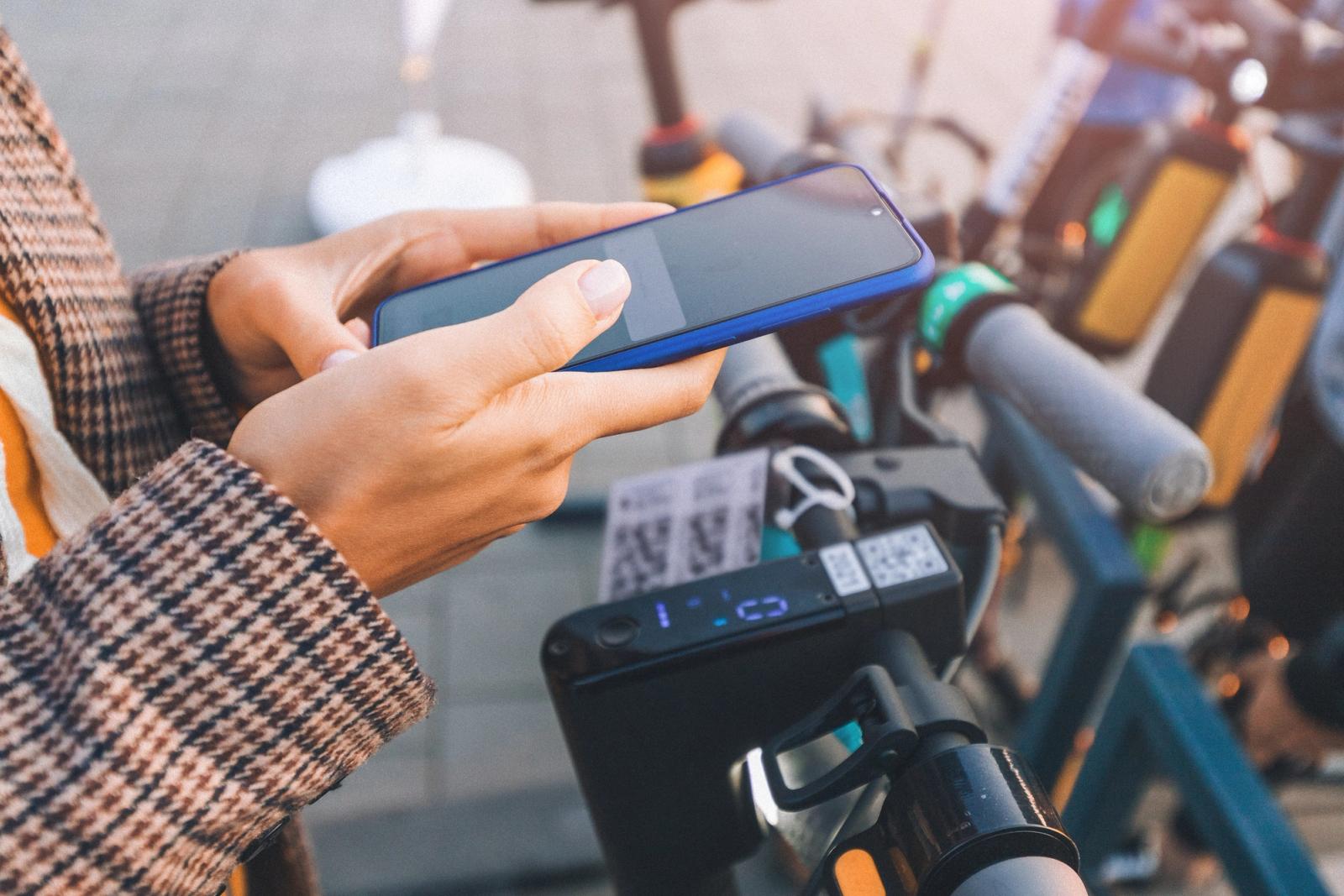 Person unlocks electric bike with their phone