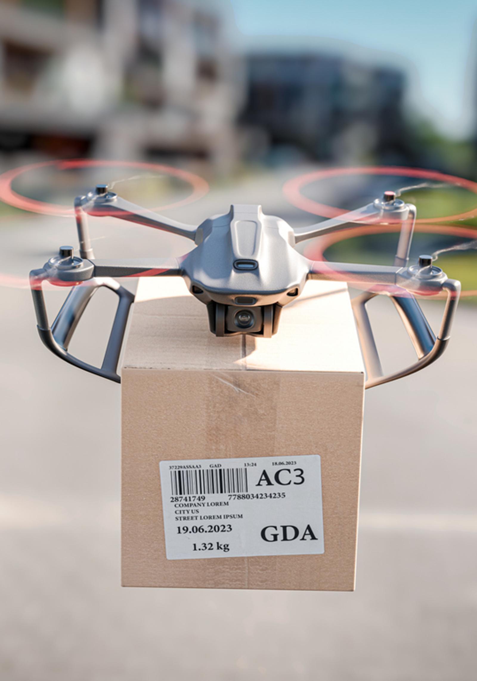 A delivery drone holding a parcel