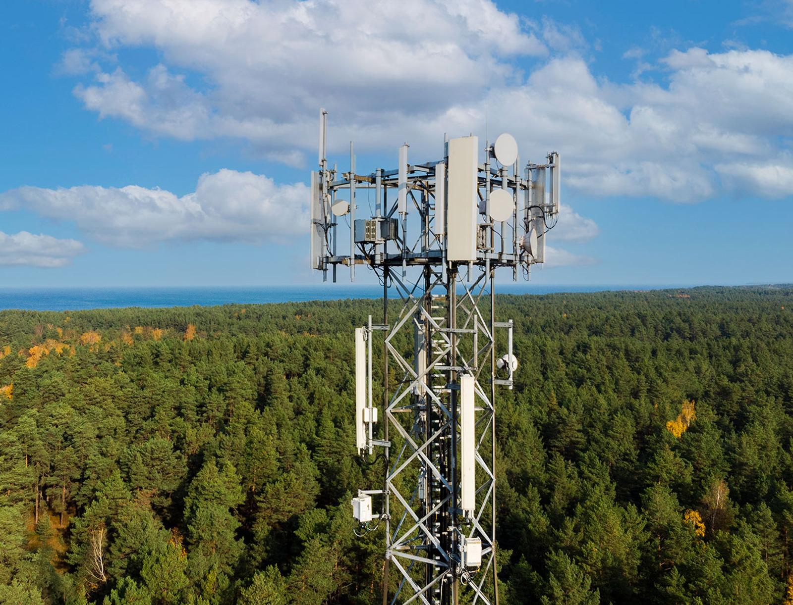 Photo of 5G towers and a bright blue sky
