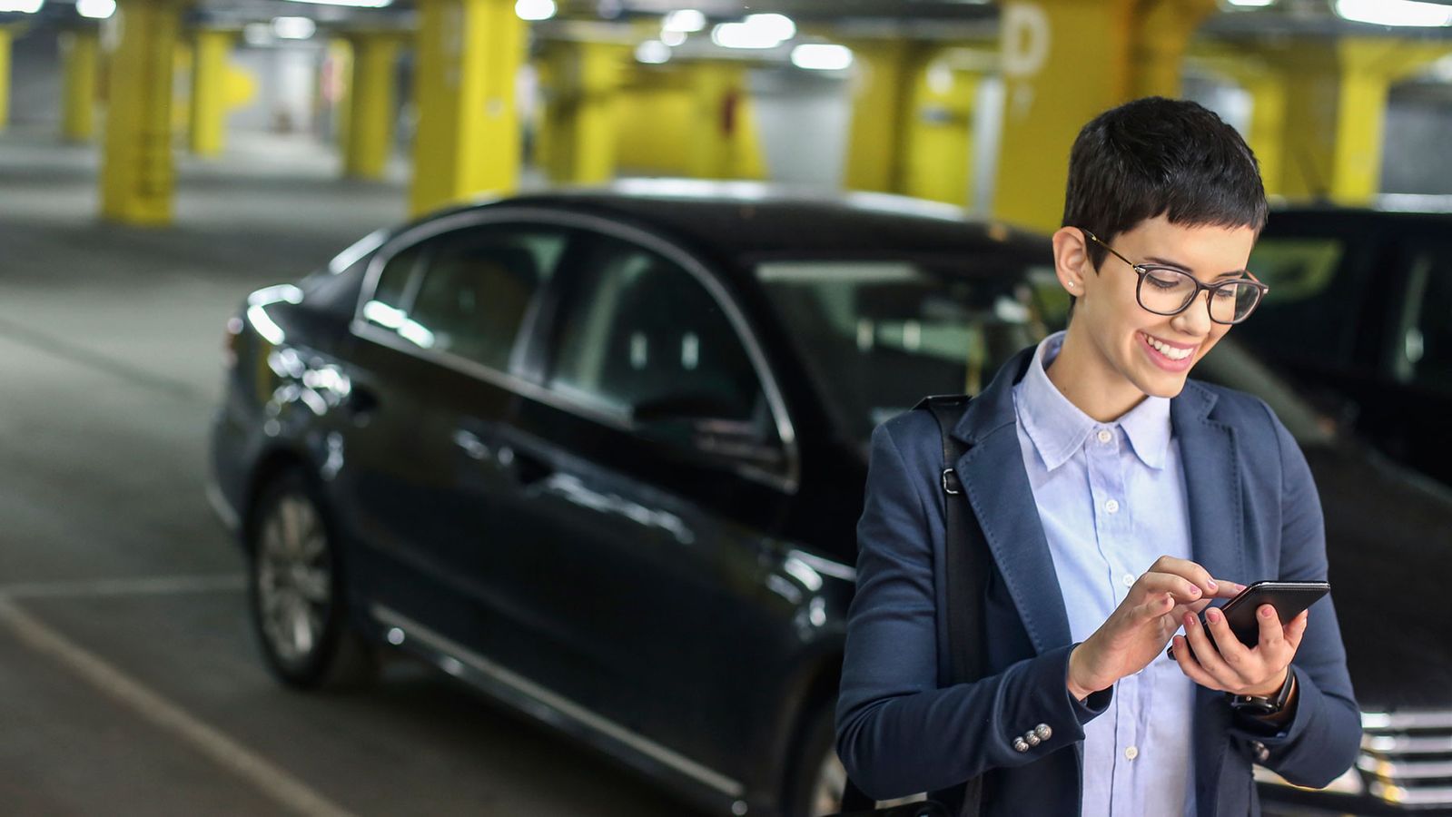 Woman using smart parking technology