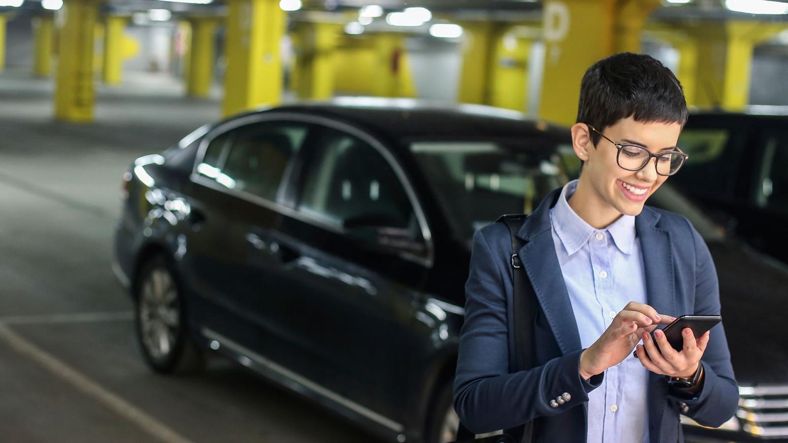 Woman using smart parking technology