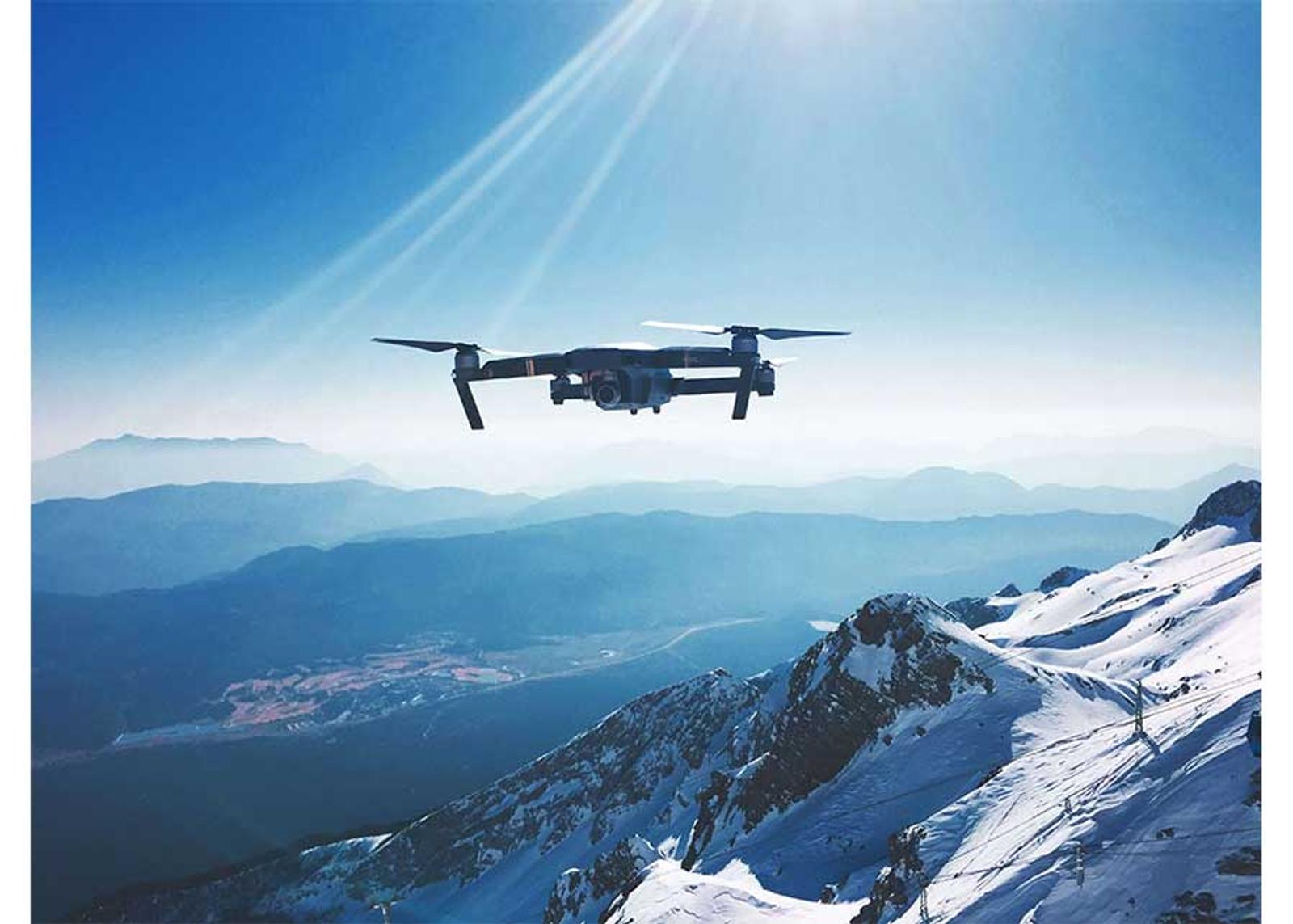 Drone flying over mountain