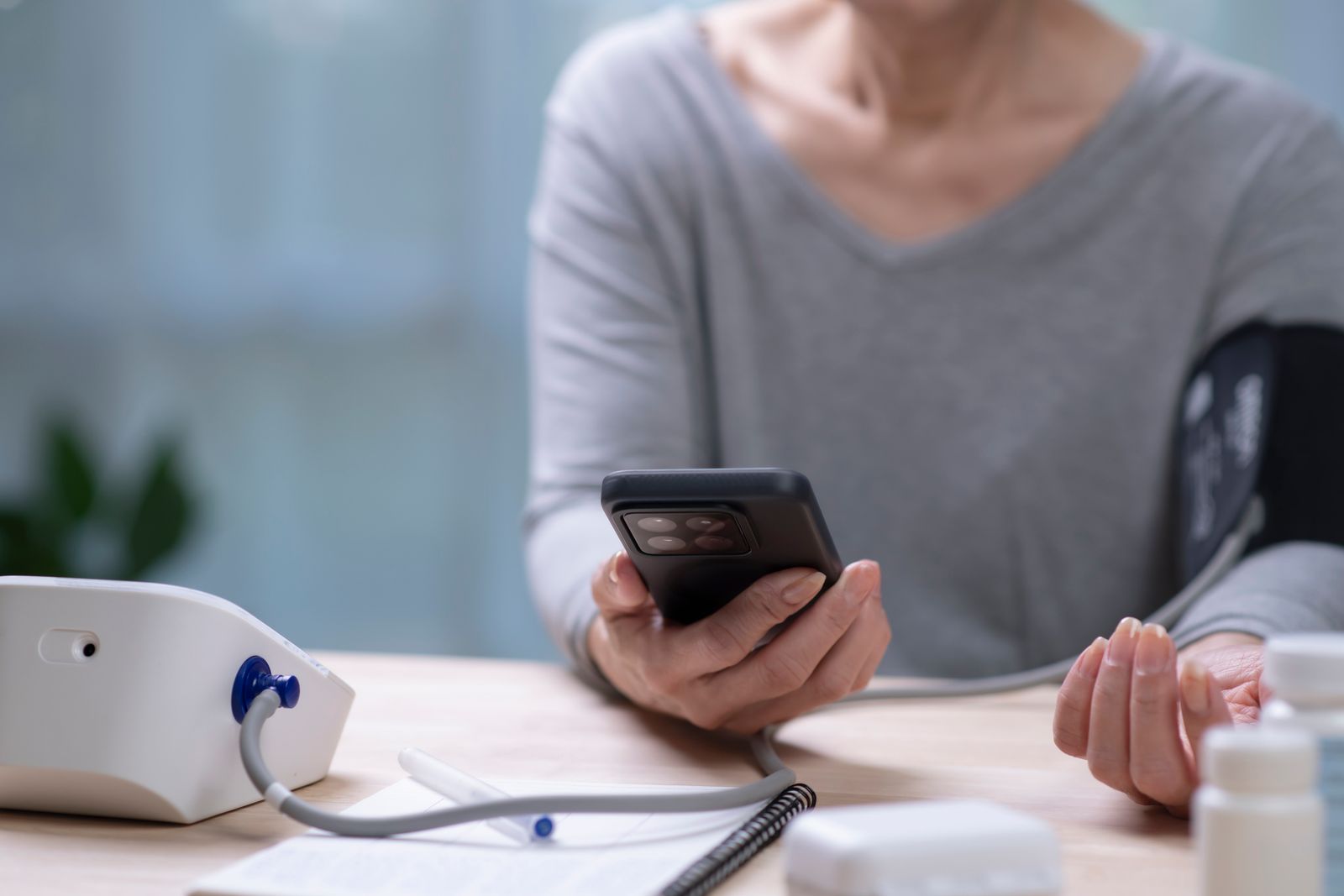 woman taking blood pressure test on phone