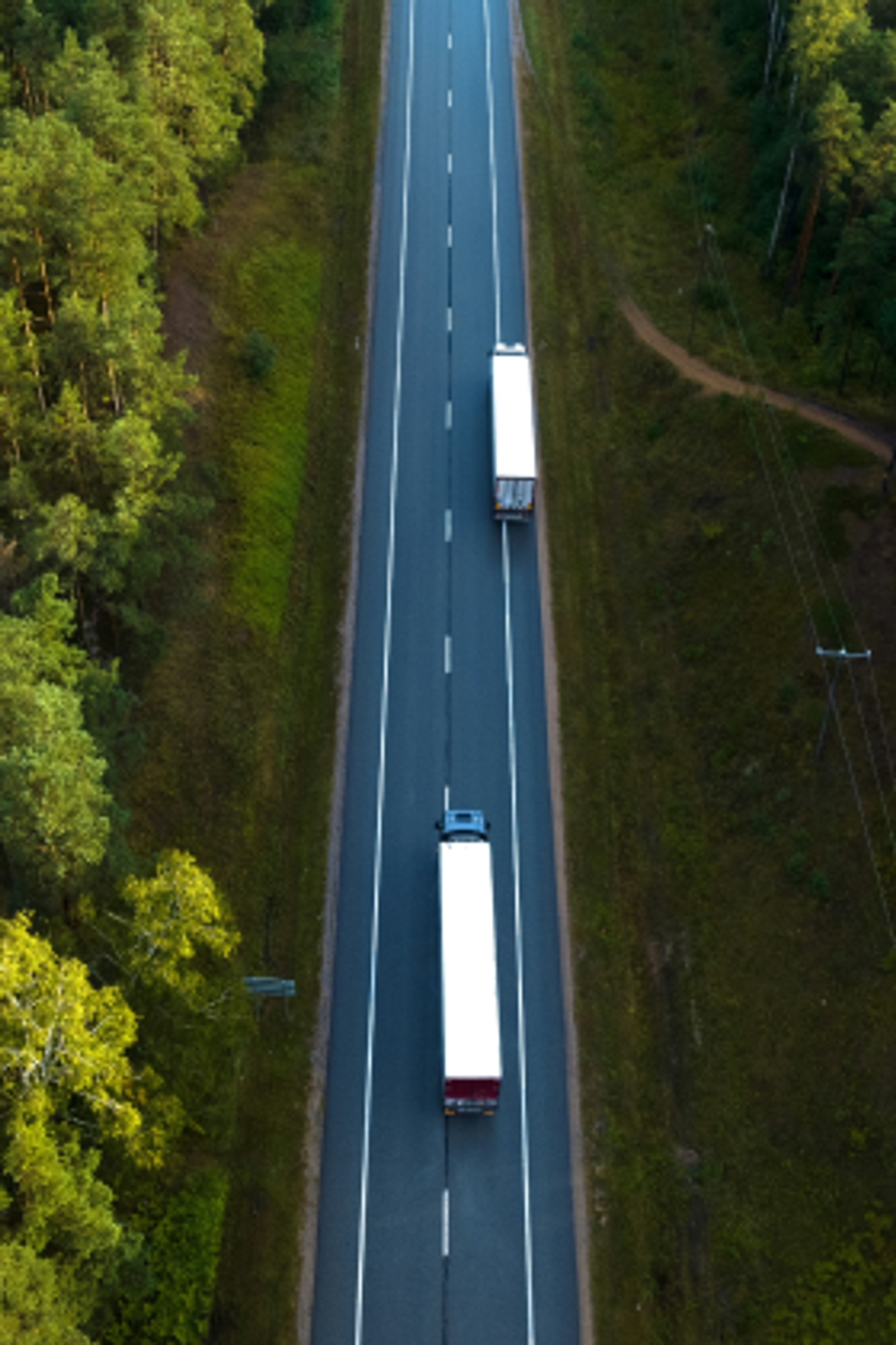 Aerial shot of two semi-trucks on a highway