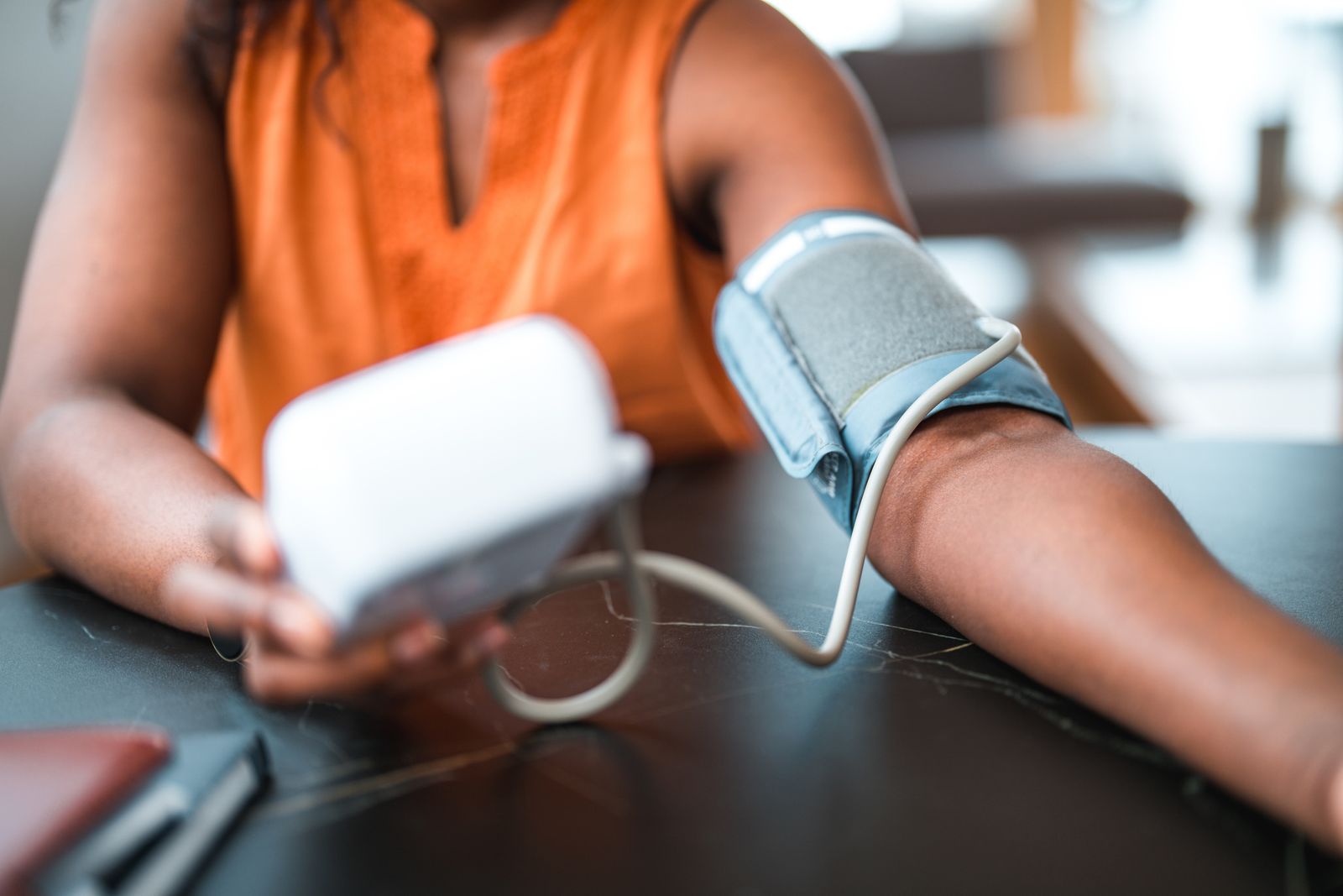 woman with remote blood pressure monitoring