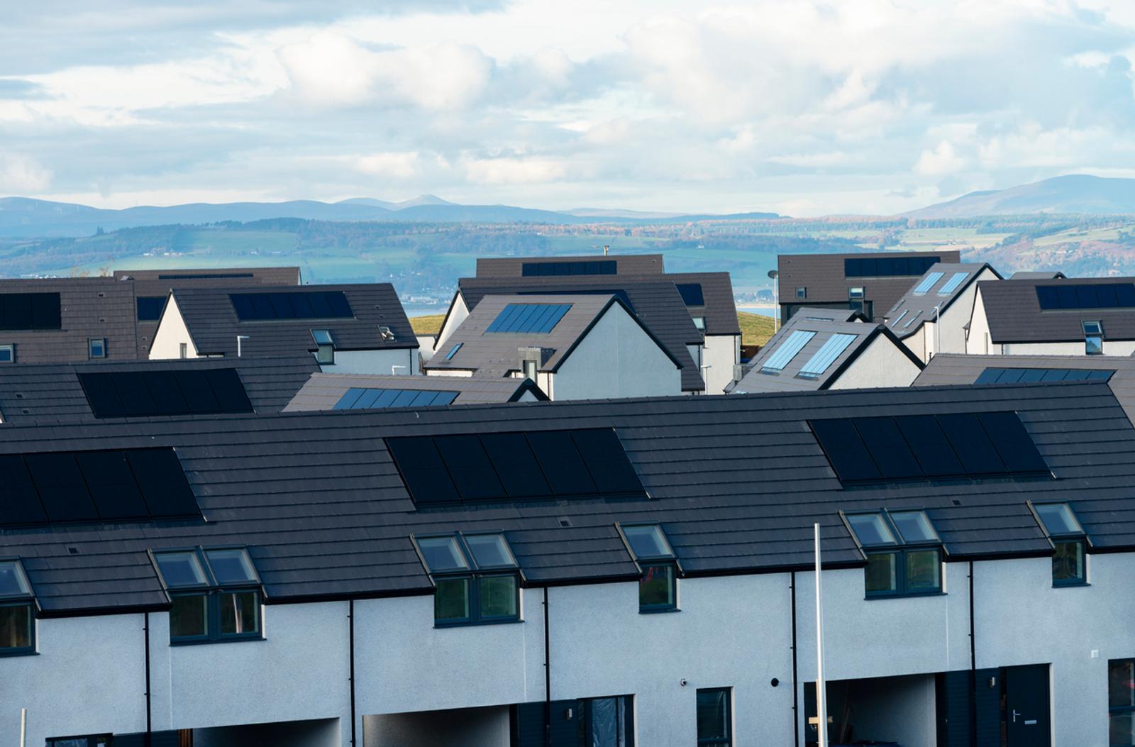 roofs of houses with solar panels Scotland UK new housing