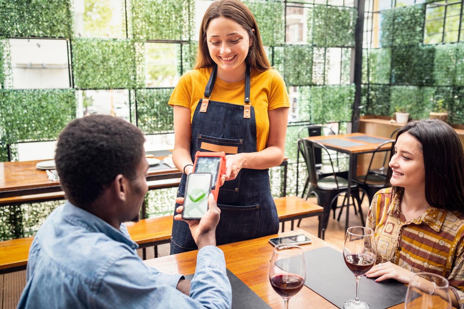 Diners paying with a mobile payment method