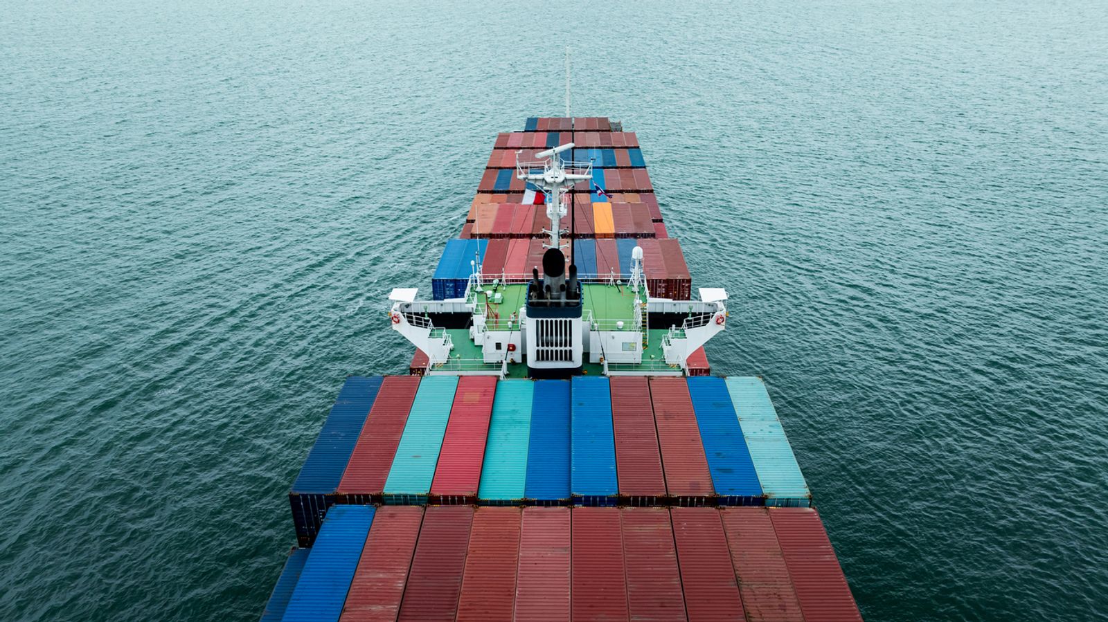 cargo container ship sailing in open ocean