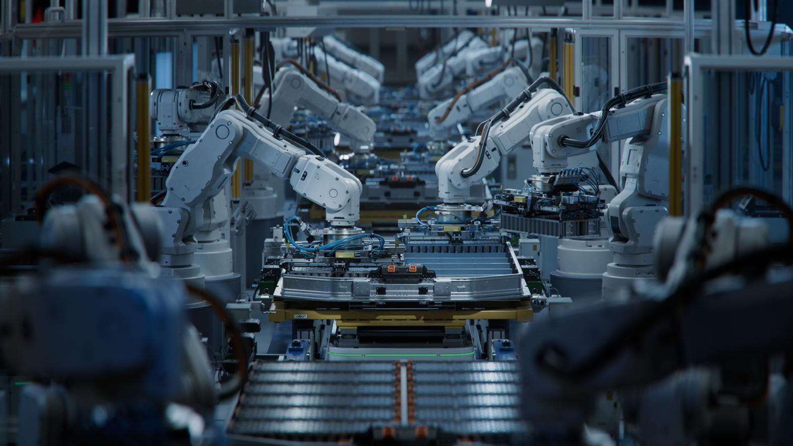 Row of White Robotic Arms at Automated Production Line at Factory