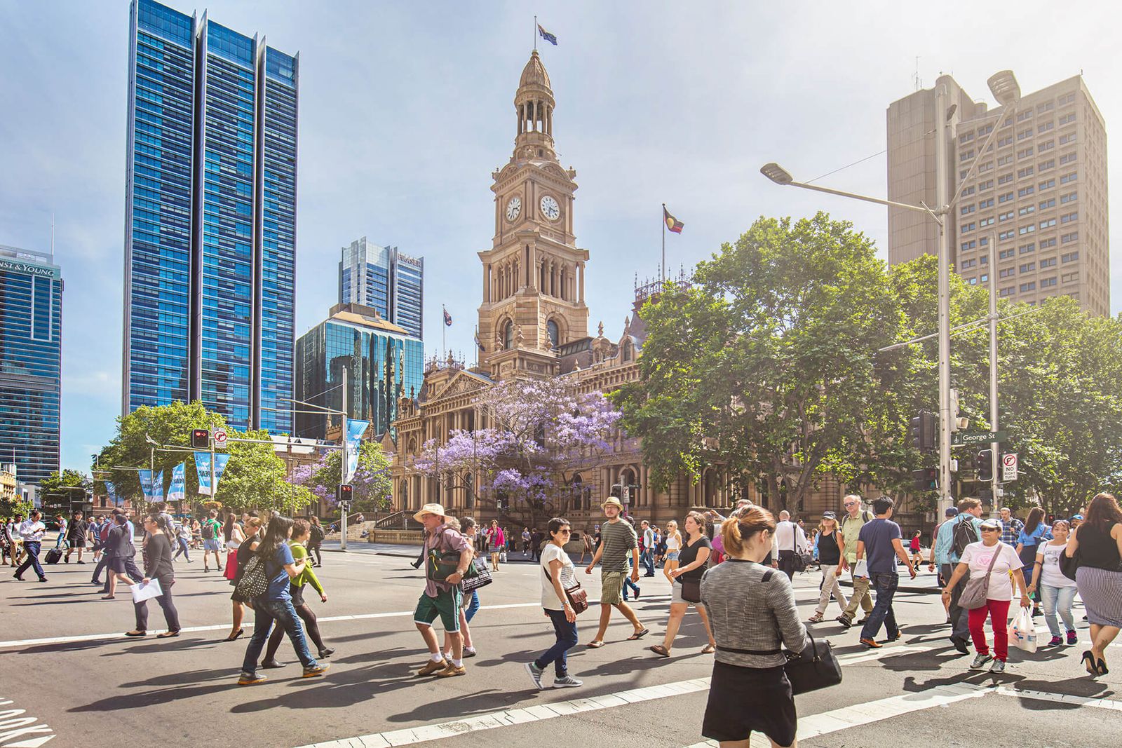 people walking in city street in summer