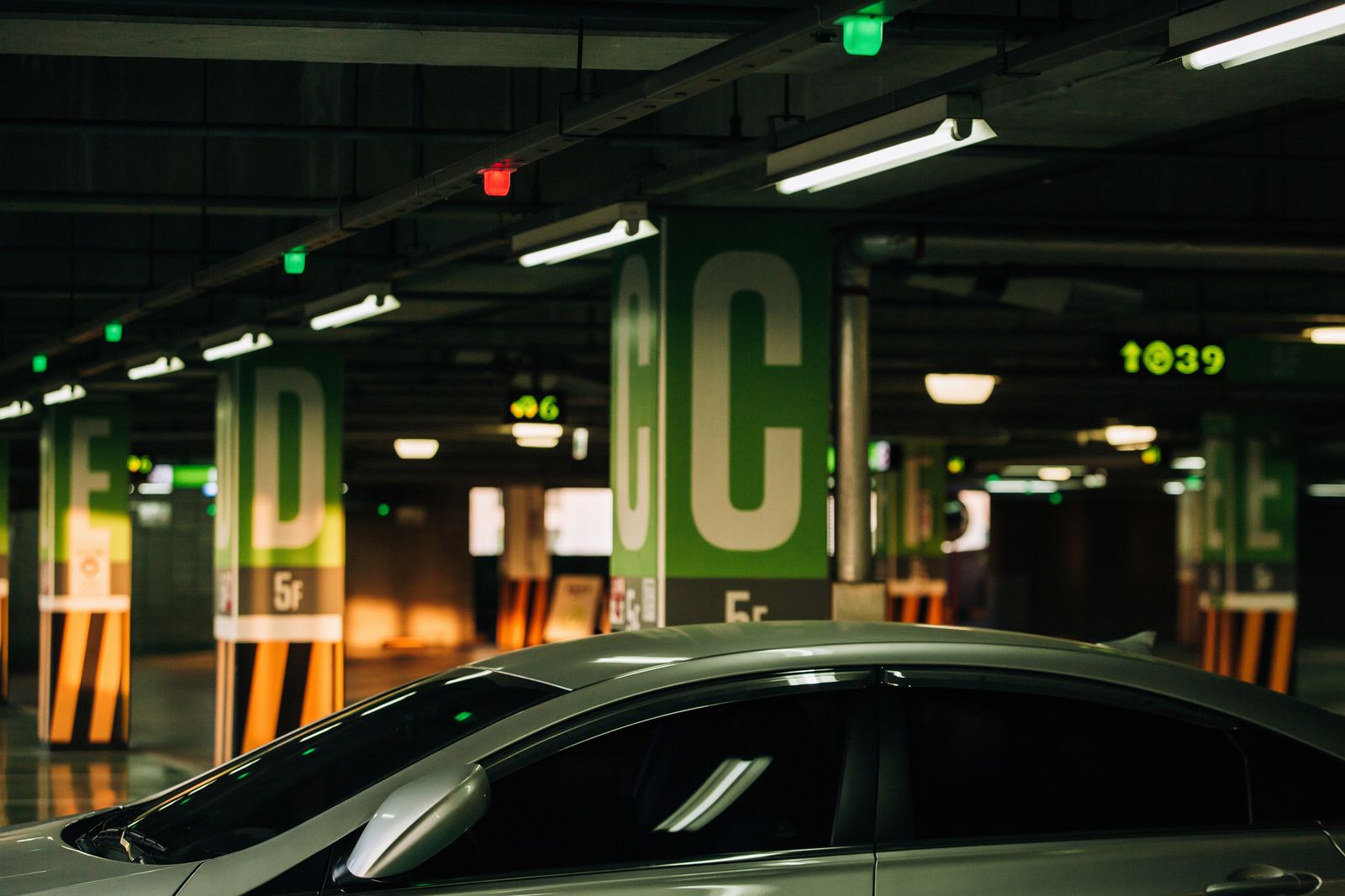 Parking garage with information displays and spot occupancy sensors.