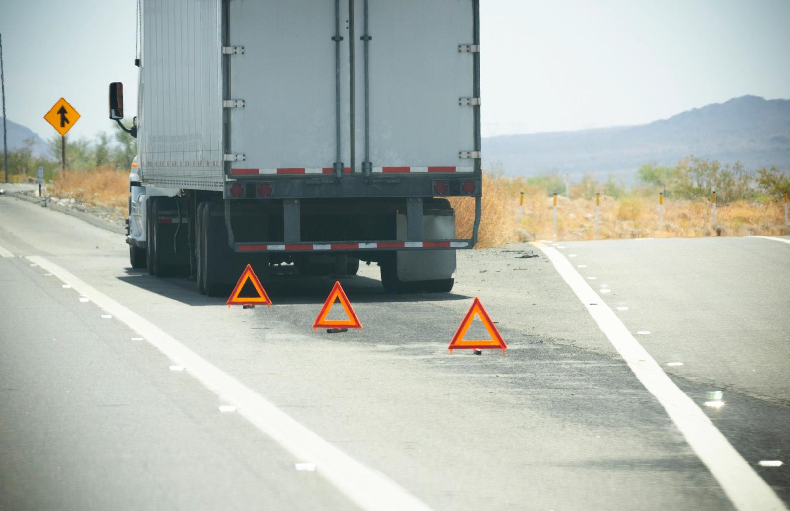 shipping truck broken down on highway