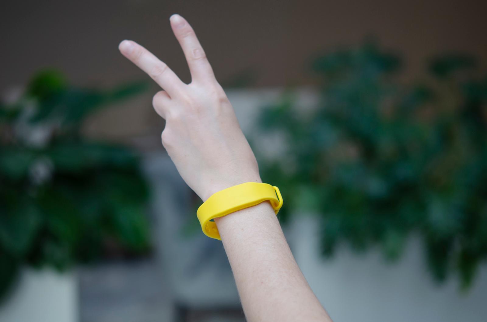 Yellow access bracelet with a chip for an entertainment event