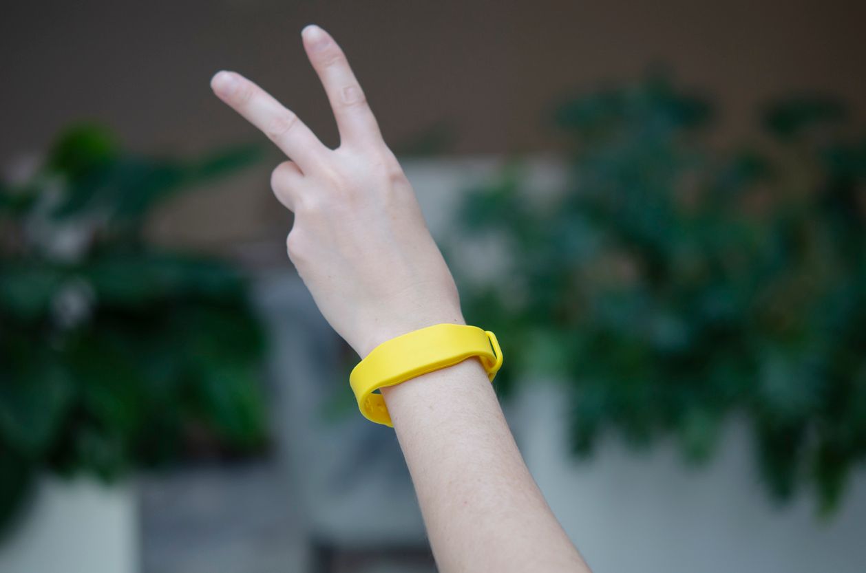 Yellow access bracelet with a chip for an entertainment event