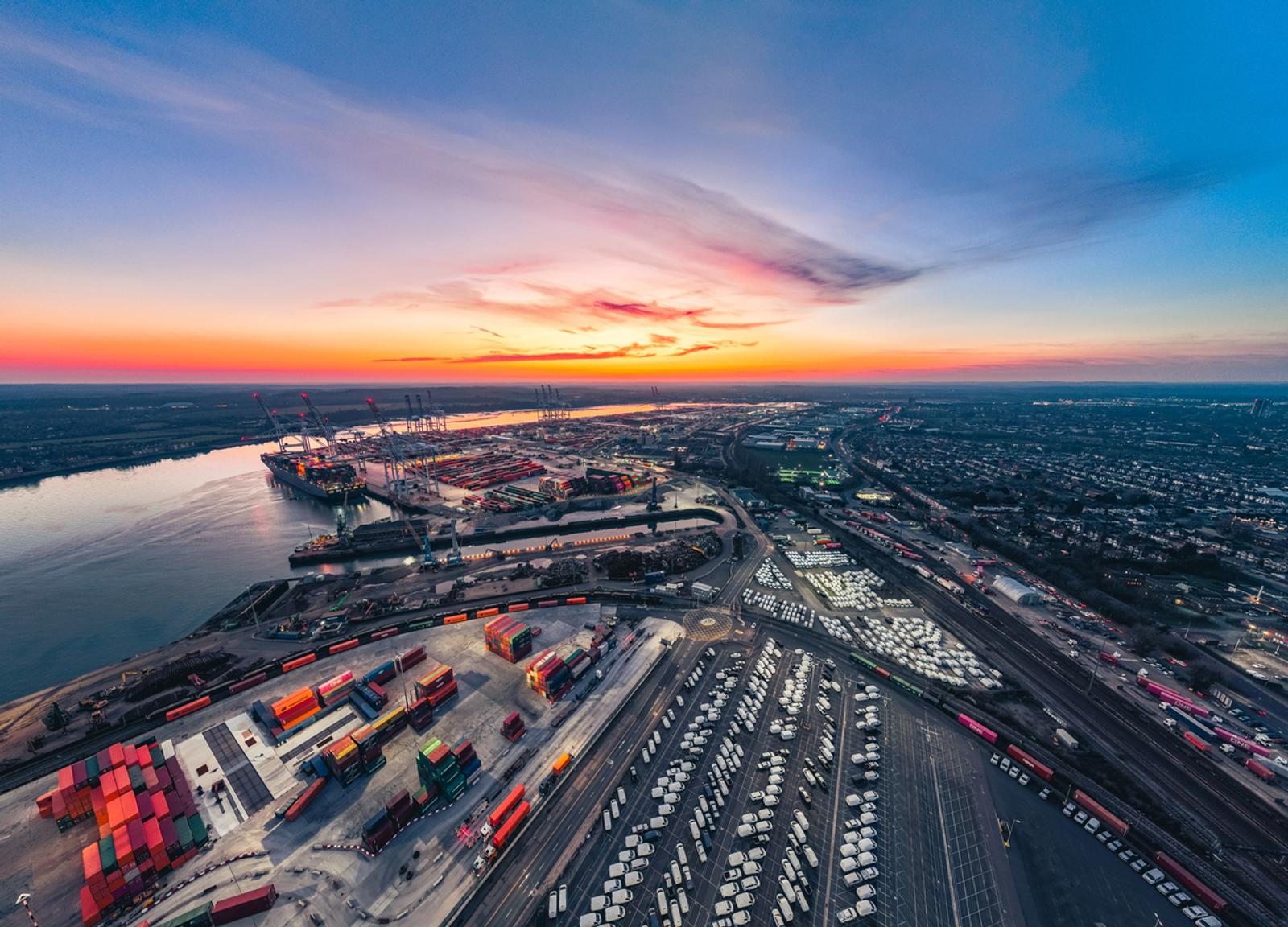 Aerial view of the Southampton container port with cargo ships and cranes, showcasing global trade and logistics