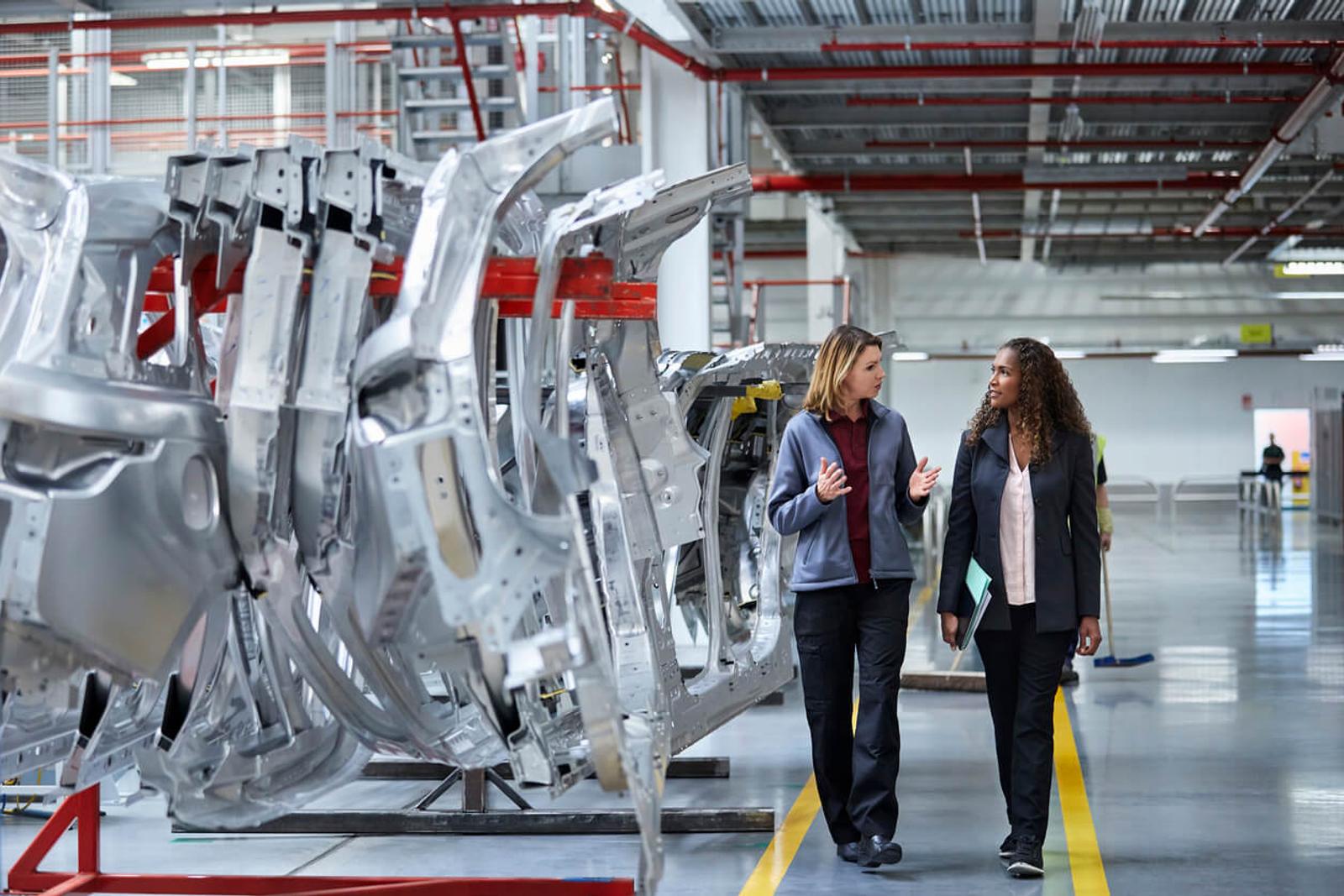 Team members walk through smart factory