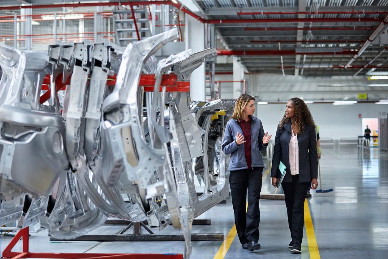 Team members walk through smart factory