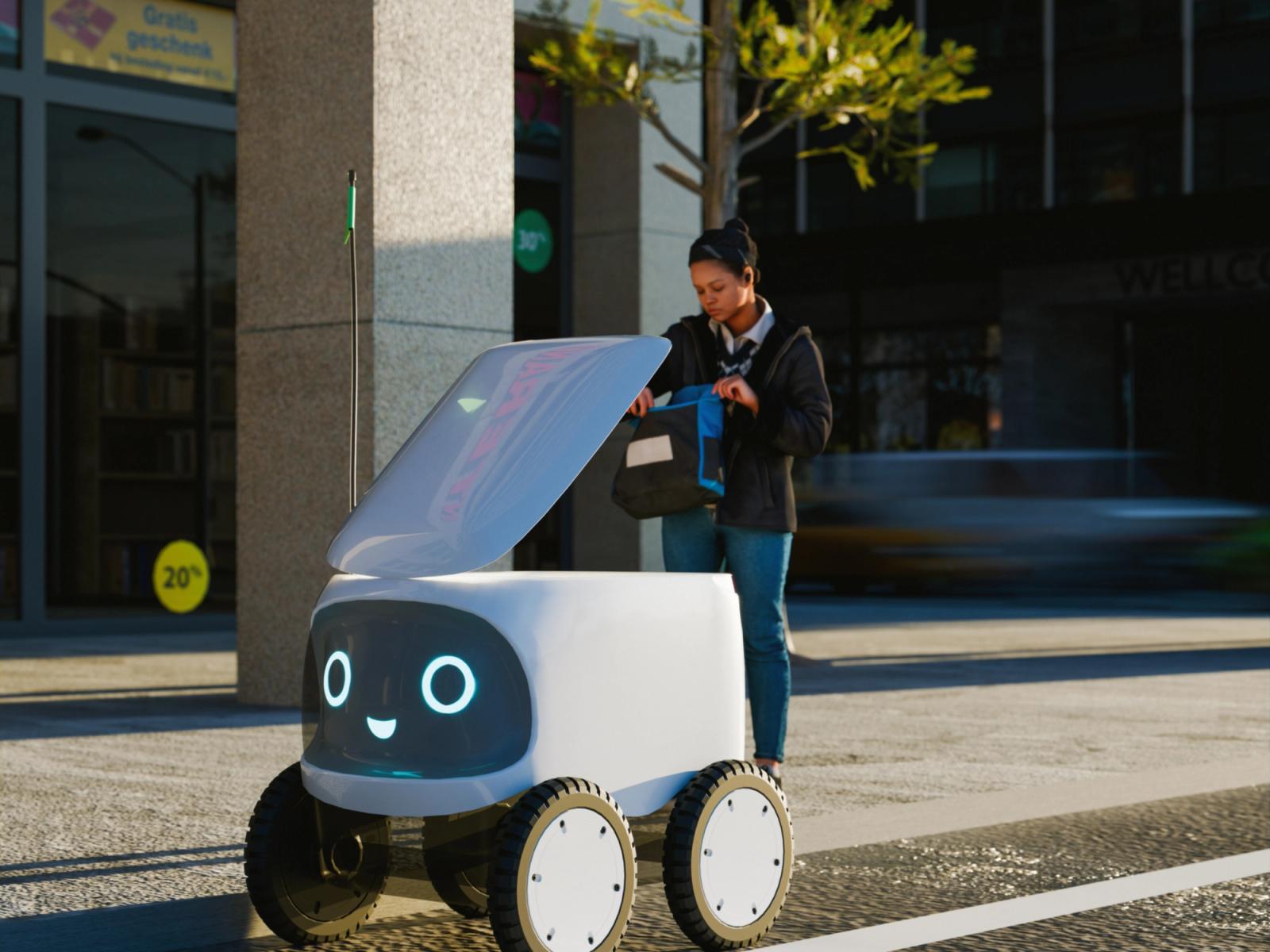 A woman takes an item from a delivery robot