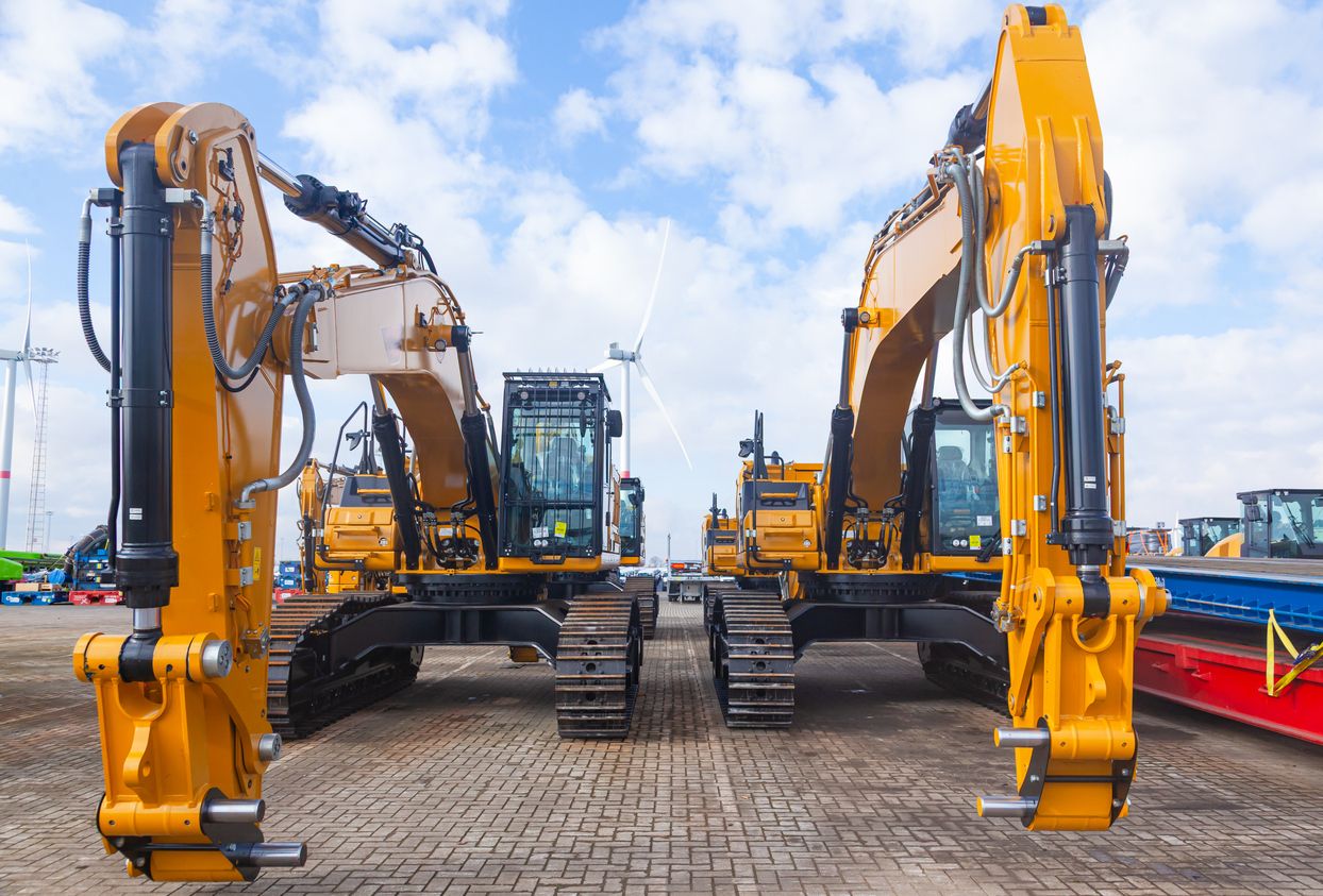 2 rental excavators in lot