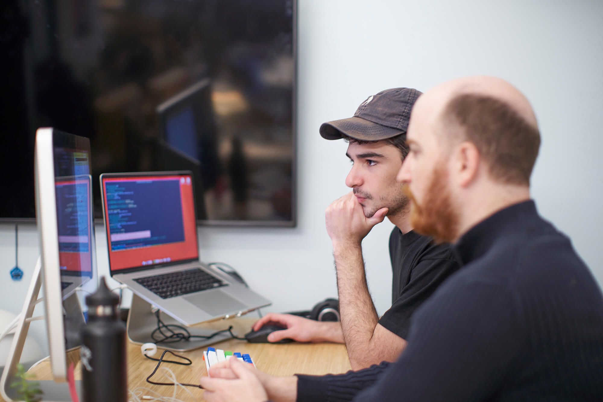 Two members of the Hologram engineering team pair programming in the Hologram office