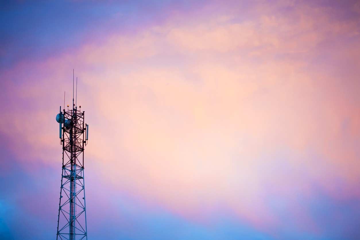 Cell tower against a sunset